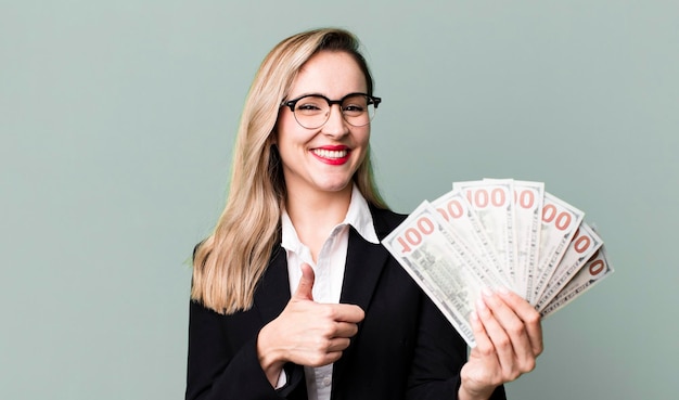 Pretty blonde woman with dollar banknotes