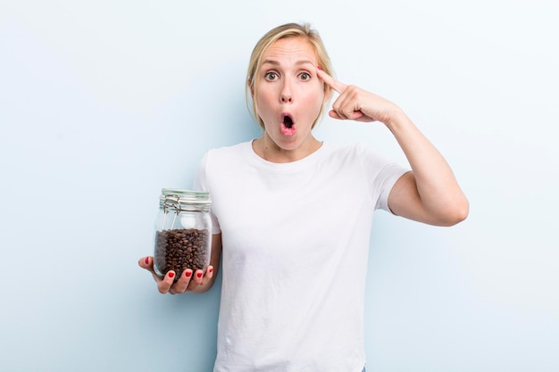 Pretty blonde young adult woman coffee beans concept