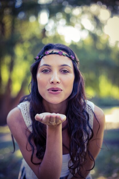 Pretty brunette blowing a kiss