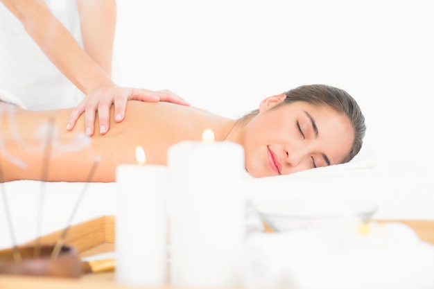 Pretty brunette enjoying a massage