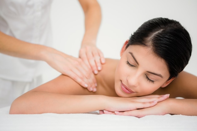 Pretty brunette enjoying a massage