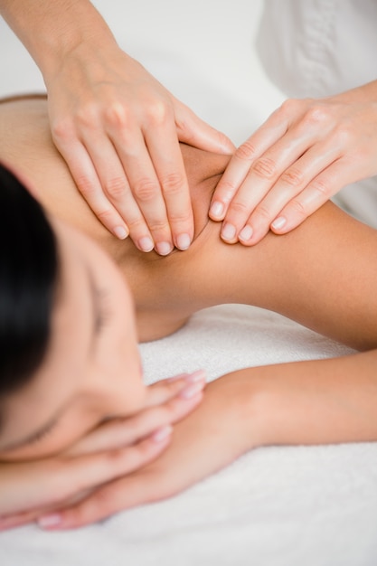 Pretty brunette enjoying a massage