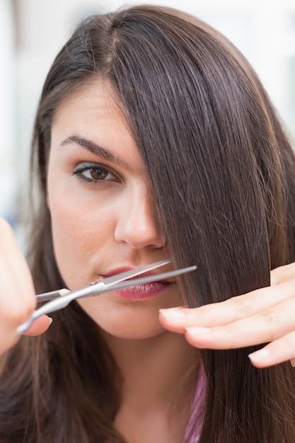 Pretty brunette getting her hair cut