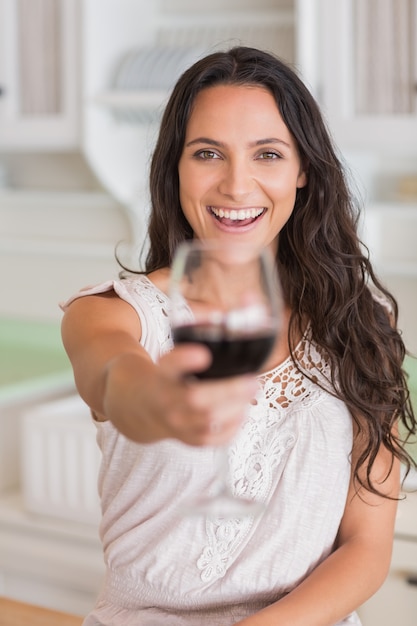 Pretty brunette holding a glass of wine 