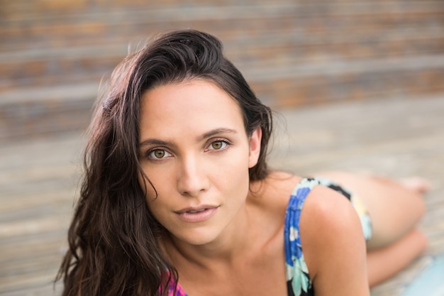 Pretty brunette lying in swimwear 