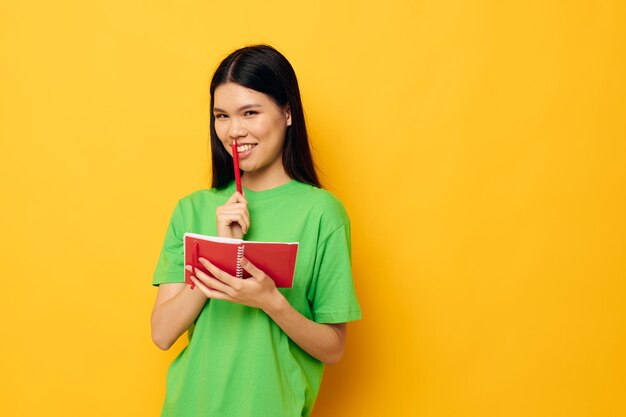 Pretty brunette notebook and pen learning education studio model unaltered