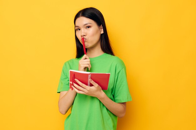 Pretty brunette notebook and pen learning education studio model unaltered