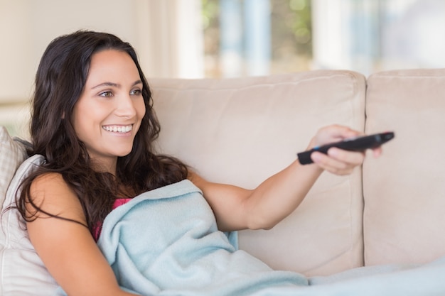 Pretty brunette relaxing on the couch 