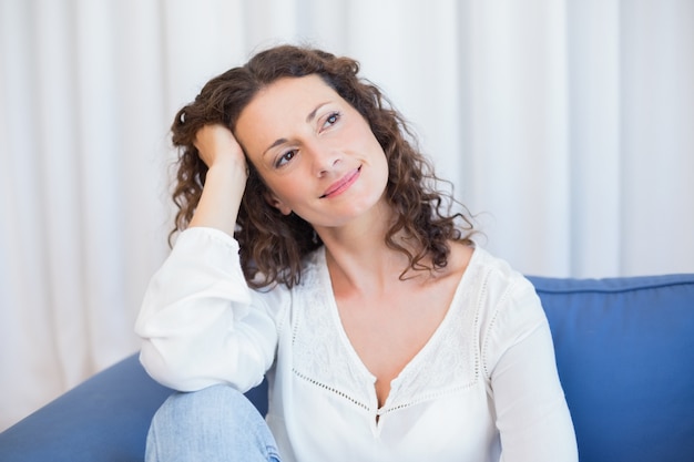 Pretty brunette relaxing on the couch