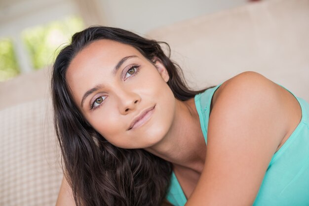 Pretty brunette relaxing on the couch 