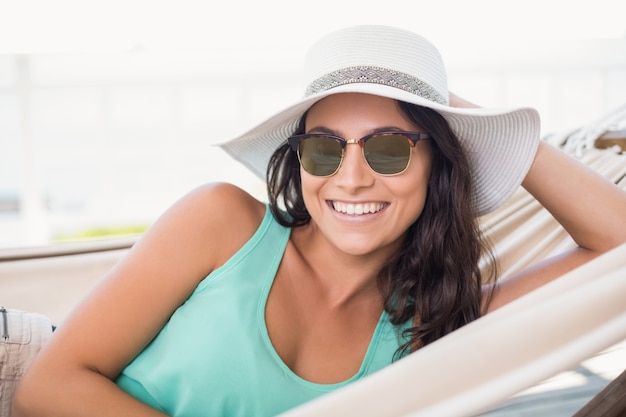 Pretty brunette relaxing on a hammock