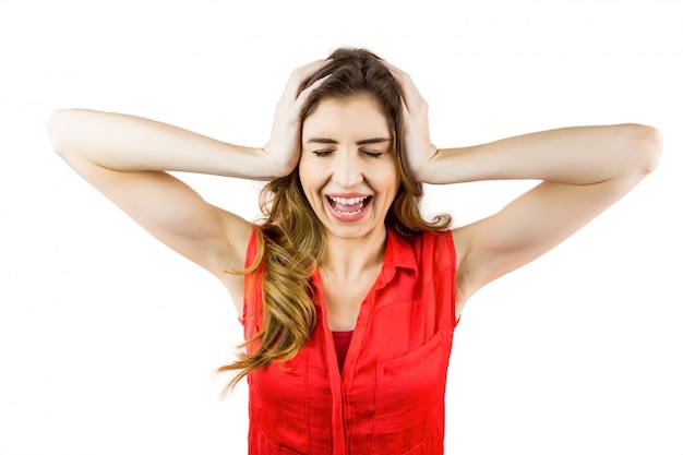 Pretty brunette shouting with hands on head