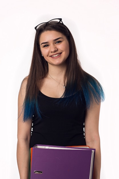 Pretty brunette student young woman with colourful folders