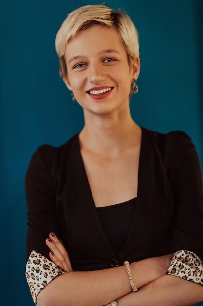 Photo pretty business woman successful confidence with arms crossed on modern blue mat background selective focus