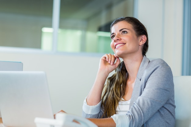 pretty businesswoman dreaming