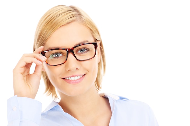 a pretty businesswoman posing in glasses over white background