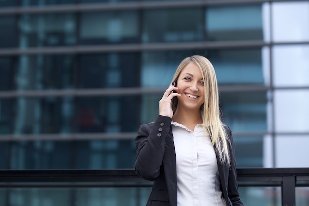 Pretty businesswoman in urban environment