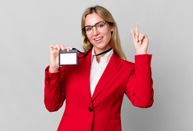 Pretty caucasian businesswoman with a vip pass acceditation card