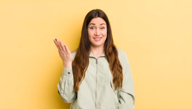 Pretty caucasian woman feeling happy surprised and cheerful smiling with positive attitude realizing a solution or idea