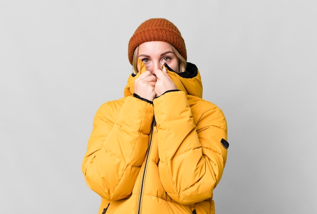 Pretty caucasian woman wearing an anorak cold and winter concept