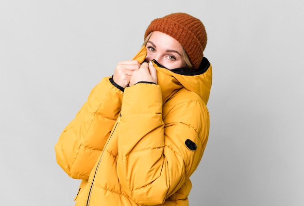 Pretty caucasian woman wearing an anorak cold and winter concept