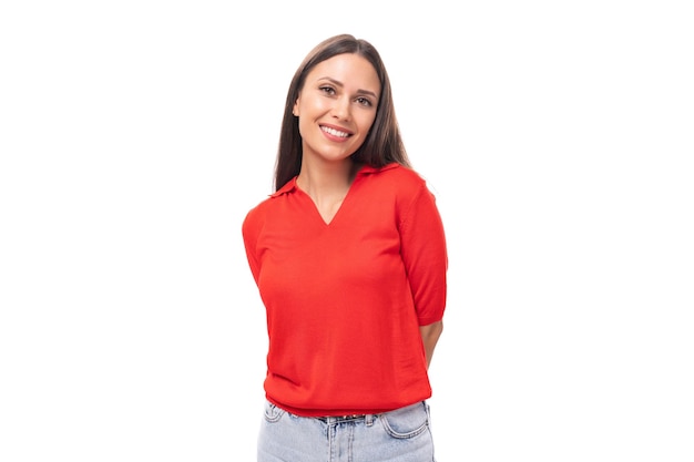 Pretty caucasian woman with black hair is wearing a red blouse with a neckline smiling with open