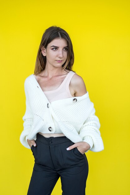 Pretty cheerful funny lady wearing white knitted sweater