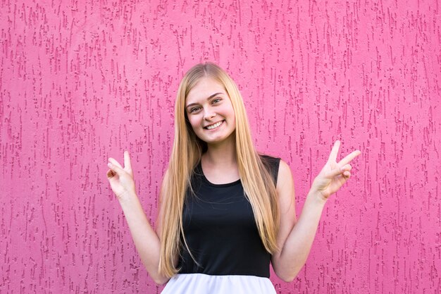 Pretty cheerful girl in stylish outfit