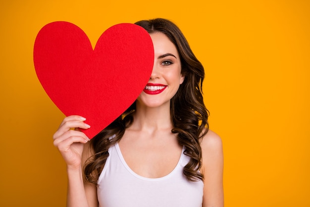 pretty cheerful lady hold big paper heart postcard