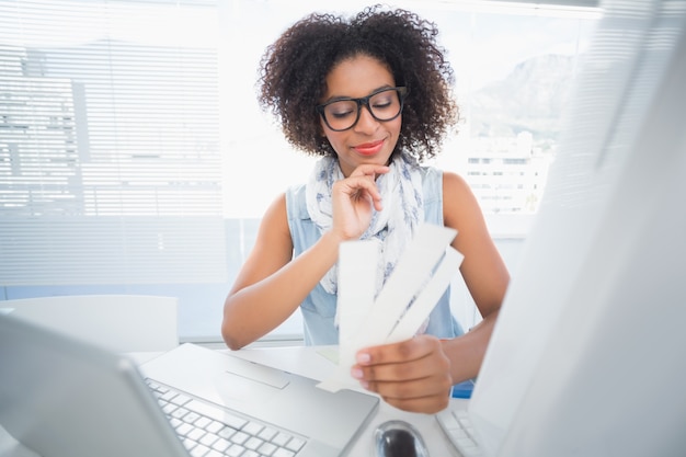 Pretty designer working at her desk