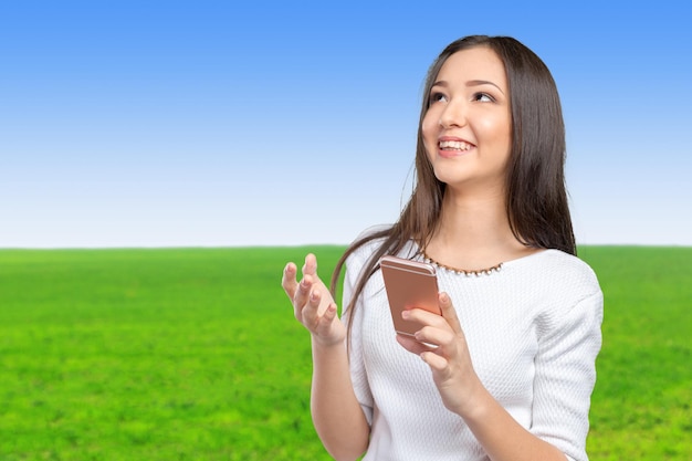 Pretty female teenager using smartphone