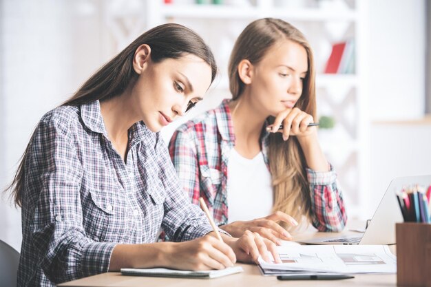 Pretty females working on project