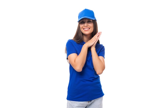 Pretty friendly young woman in blue cotton tshirt and cap with merch perspective