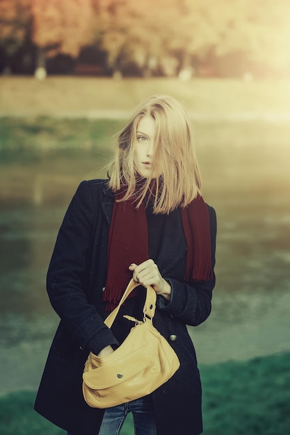 Pretty girl in autumn park