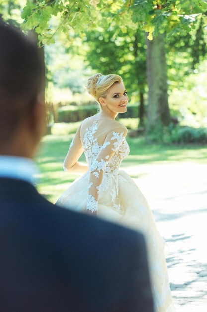 Pretty girl or cute bride in white sexy wedding dress