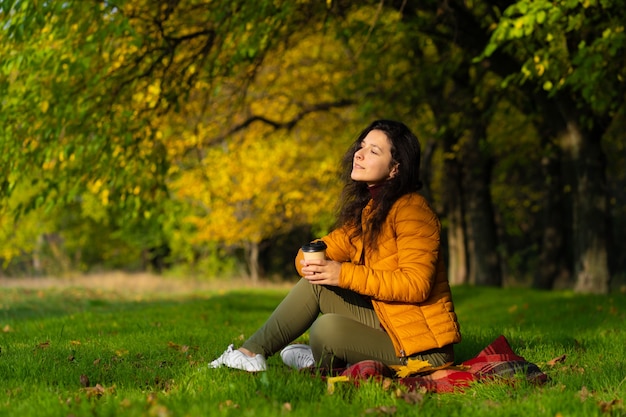 Pretty girl enjoys autumn