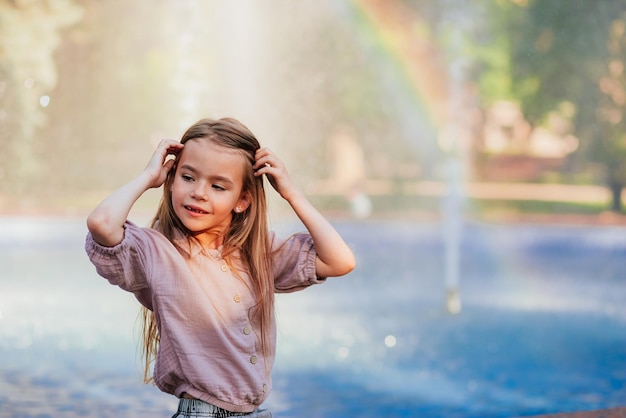 pretty girl having fun by the pool