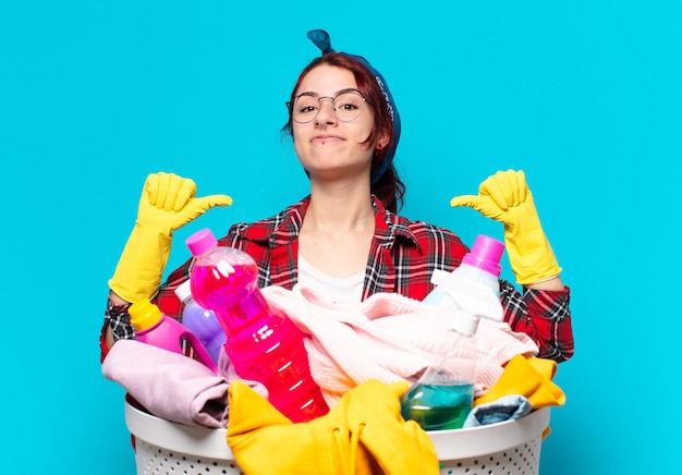 Pretty girl housekeeper washing clothes