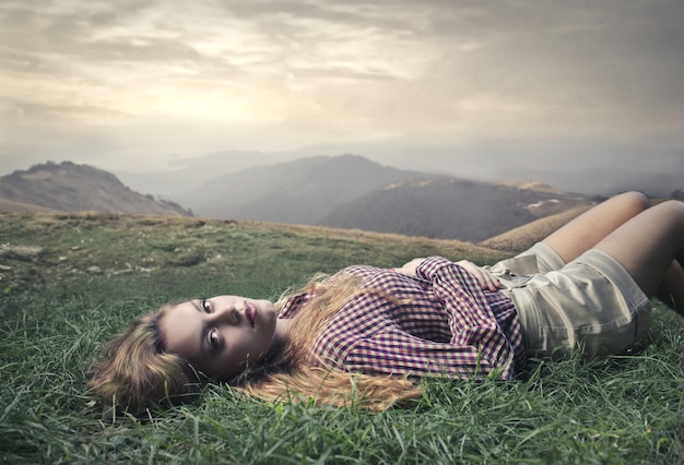 Pretty girl lying in nature