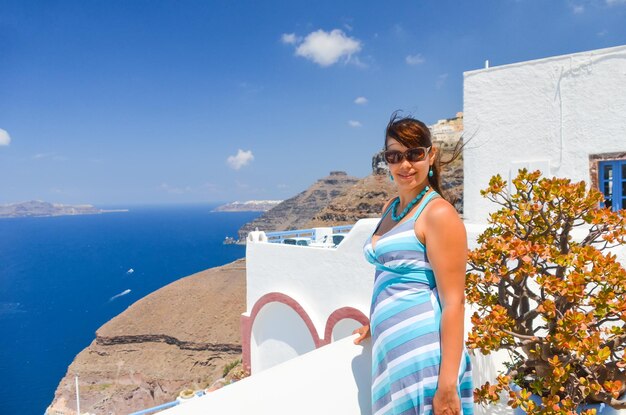 Pretty girl on the mountainside in Santorini