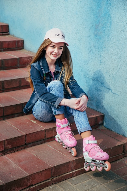 Pretty girl on roller skates in city