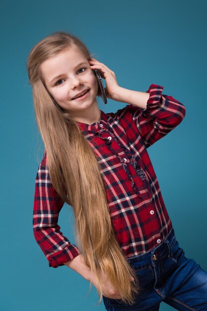 Pretty girl in shirt with long hair hold the phone