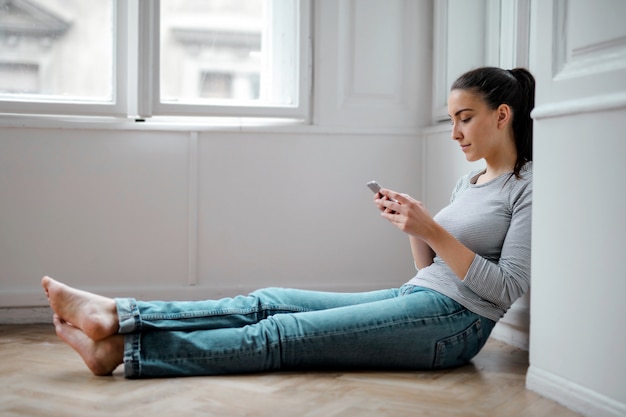 Pretty girl texting at home