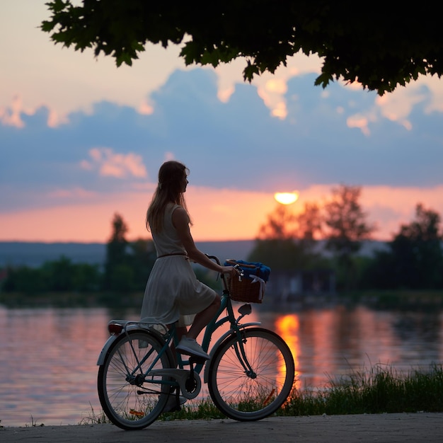 Pretty girl with a blue bike