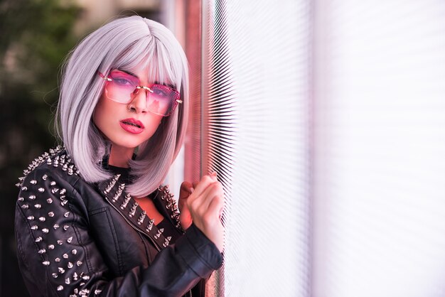 Pretty girl with stylish clothes posing near led lights - Beautiful woman portrait