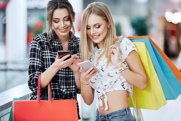 Pretty girls posing while shopping