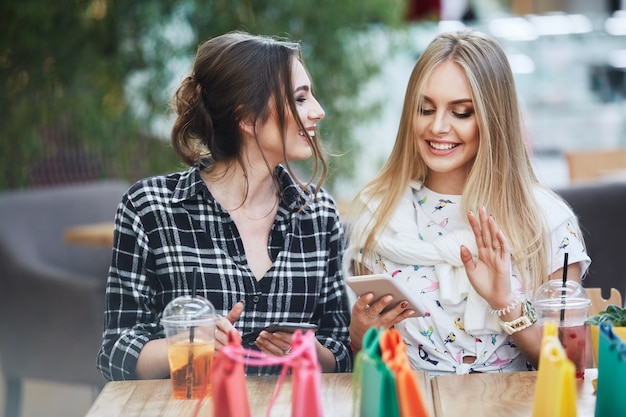 Pretty girls posing while shopping