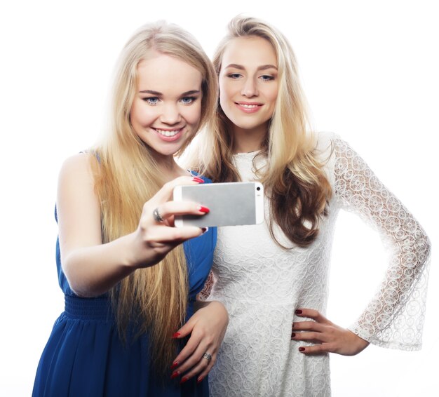 Pretty  girsl taking selfie. Isolated on white background.