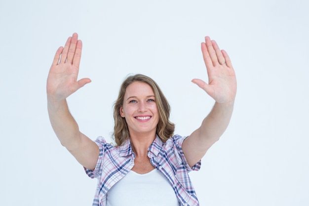 Pretty hipster doing frame with her hands