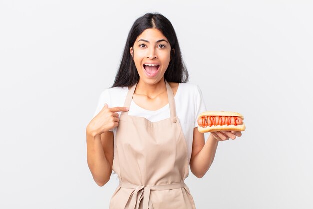 pretty hispanic chef woman against isolates wall